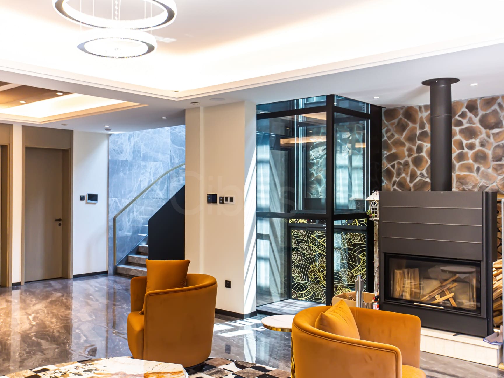 Cibes lift with panoramic glass cabin in a bright modern living room