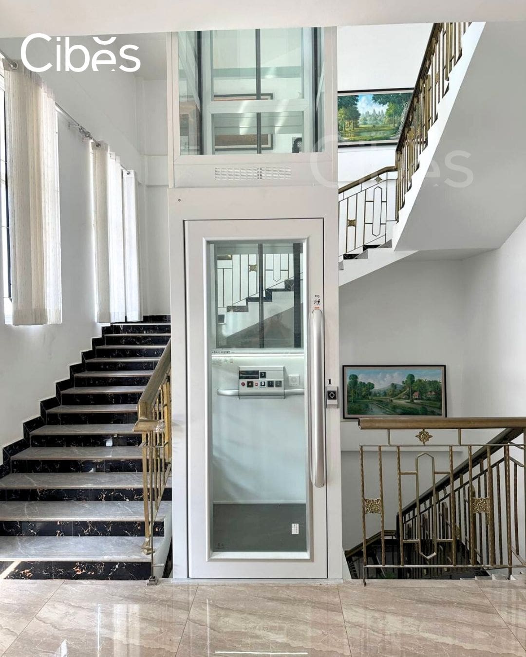 Pitless home elevator installed inside stairwell.