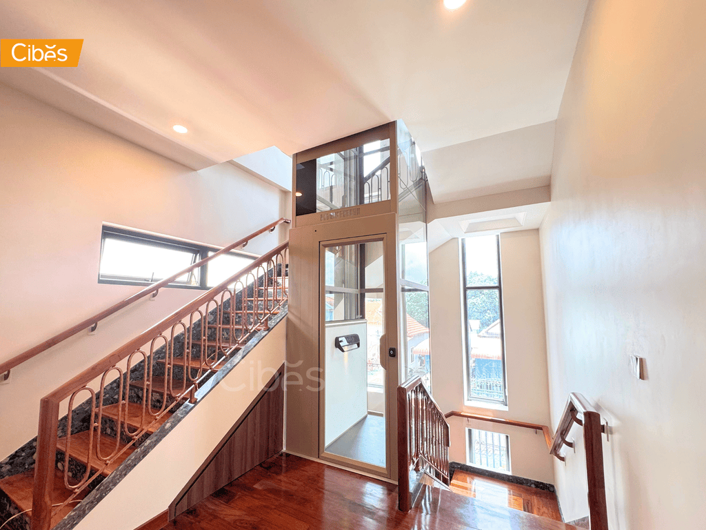Cibes screw-driven commercial lift installed in the middle of the stair in Cambodia.